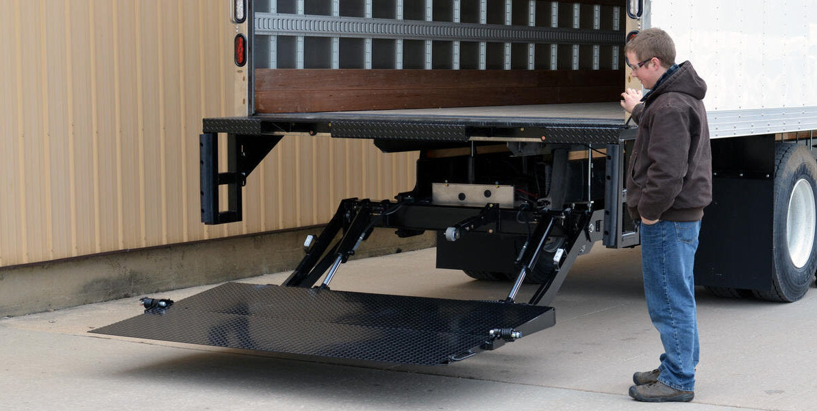 A truck liftgate lowered to the ground
