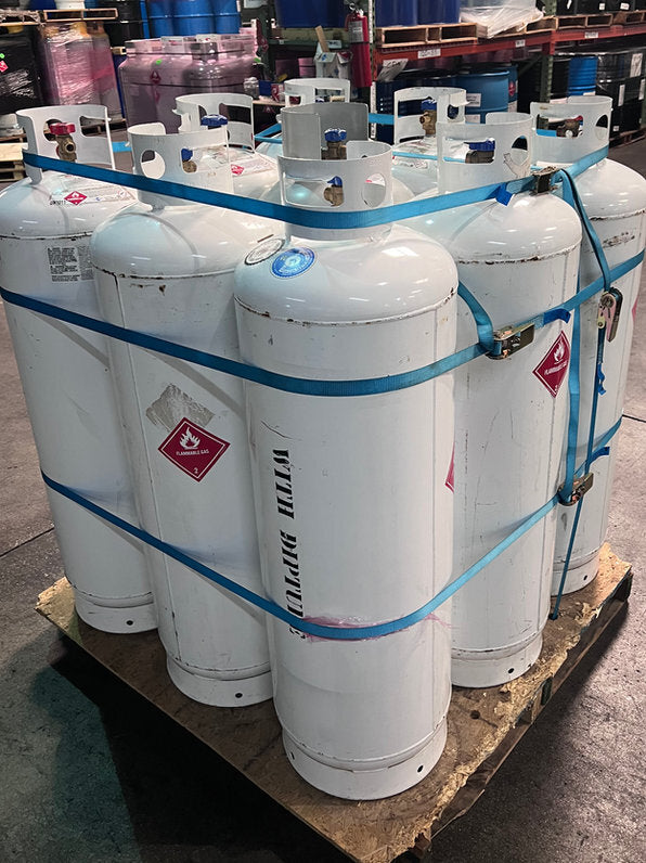 A strapped pallet of empty cylinders, another view