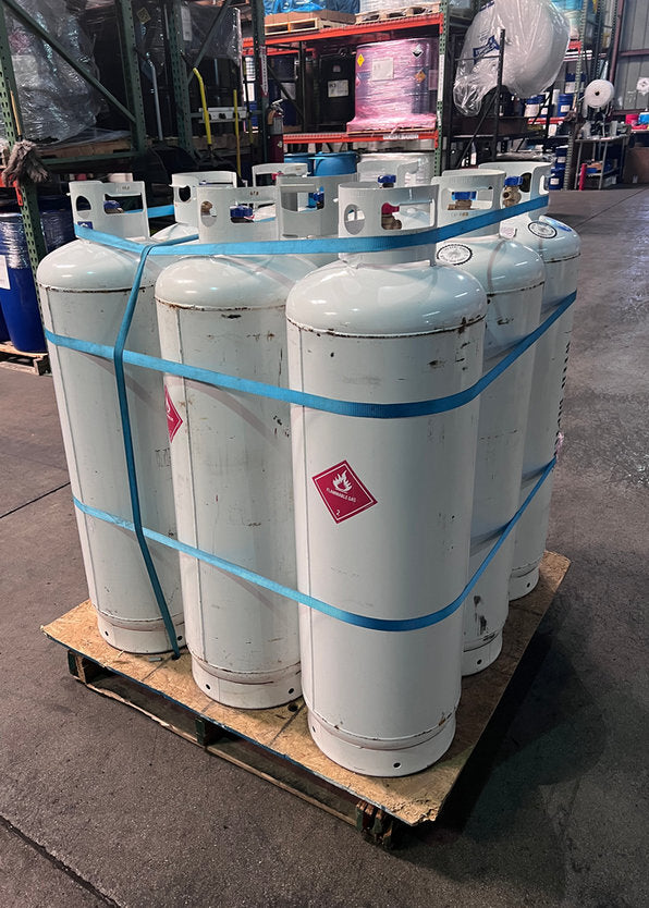 A strapped pallet of empty cylinders, another view